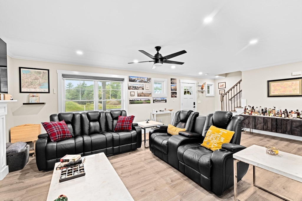 8 Big River Road Coventry, RI 02816 - Photo 8 of 42 a living room with furniture ceiling fan and a rug
