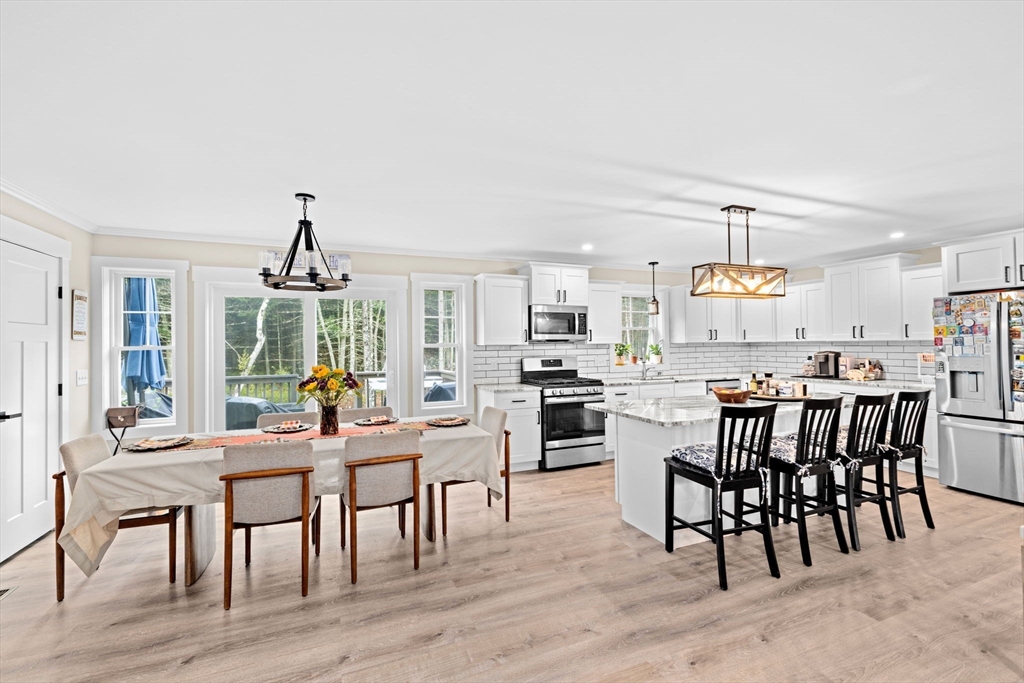 8 Big River Road Coventry, RI 02816 - Photo 9 of 42 a view of a dining room with furniture window and wooden floor