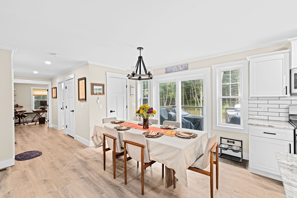 8 Big River Road Coventry, RI 02816 - Photo 10 of 42 a dining room with furniture garden view and a chandelier