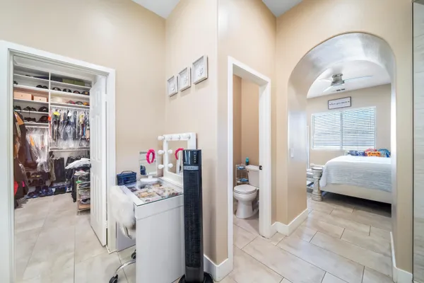 a bedroom with a bed and a couch