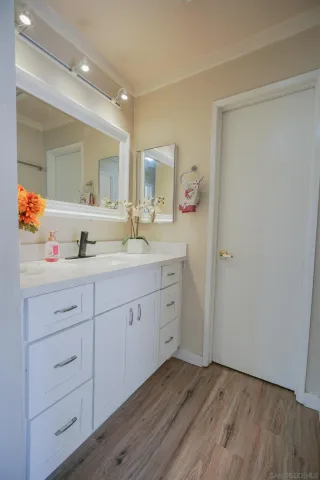 a view of hallway with wooden floor