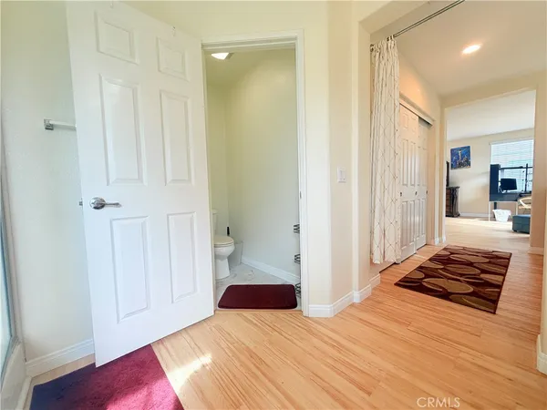 a bedroom with a bed and a walk in closet