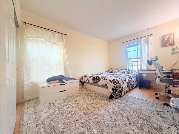 a bedroom with a bed and a table in it