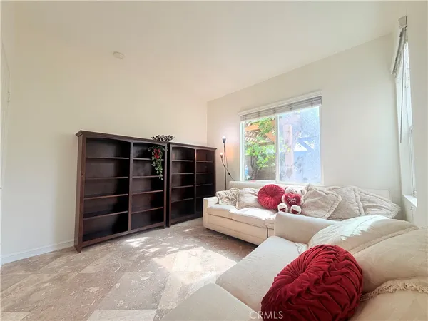 a living room with furniture closet and window