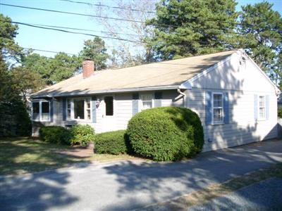 18 Edgewood Road Dennis Port, MA 02639 - Photo 21 of 21 a front view of a house with a garden