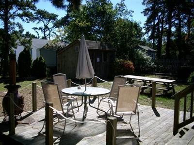 18 Edgewood Road Dennis Port, MA 02639 - Photo 3 of 21 a view of a backyard with furniture and a tub