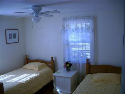 18 Edgewood Road Dennis Port, MA 02639 - Photo 9 of 21 a bedroom with a bed and furniture