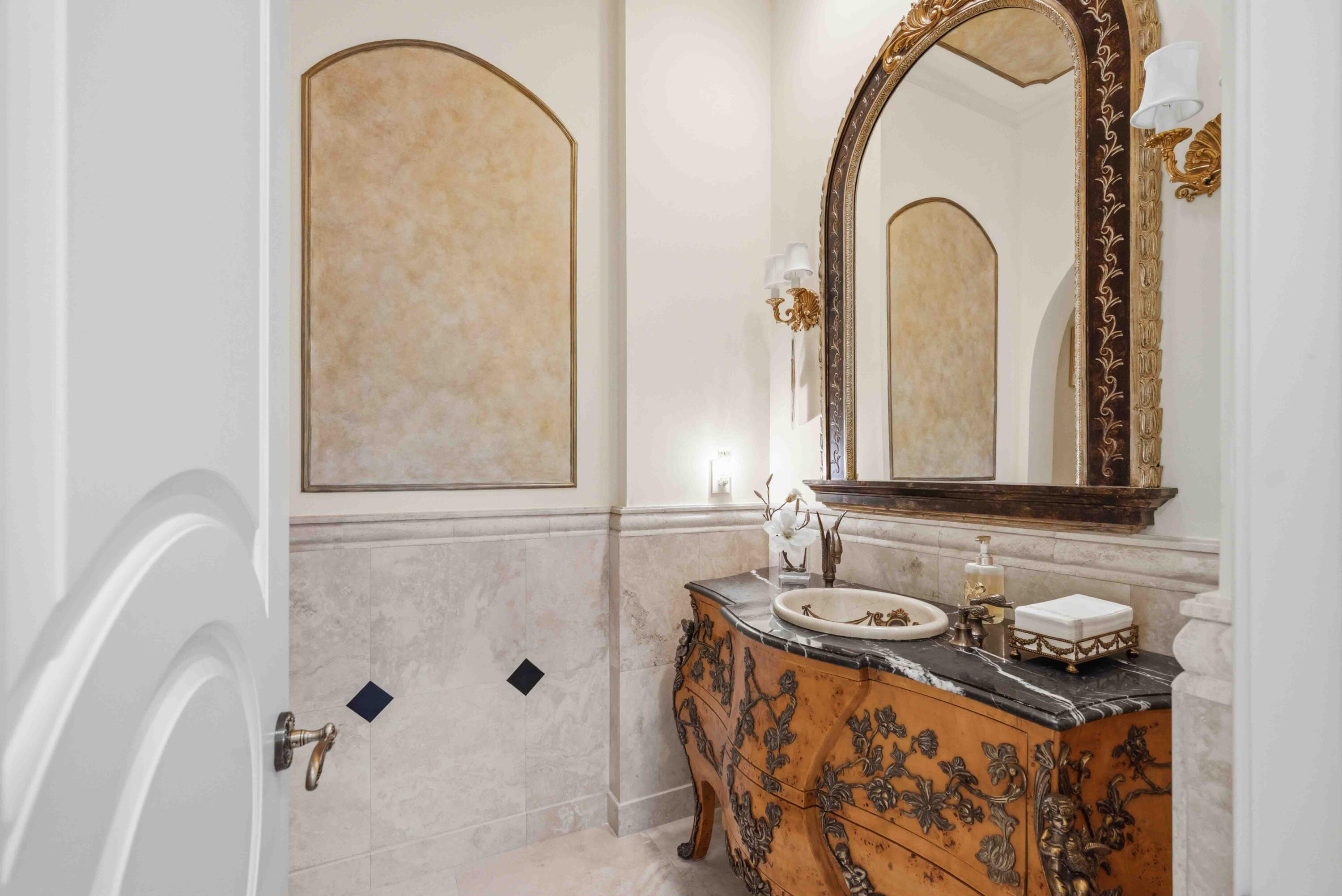 18118 Daybreak Drive Boca Raton, FL 33496 - Photo 19 of 84 a bathroom with a sink and a mirror