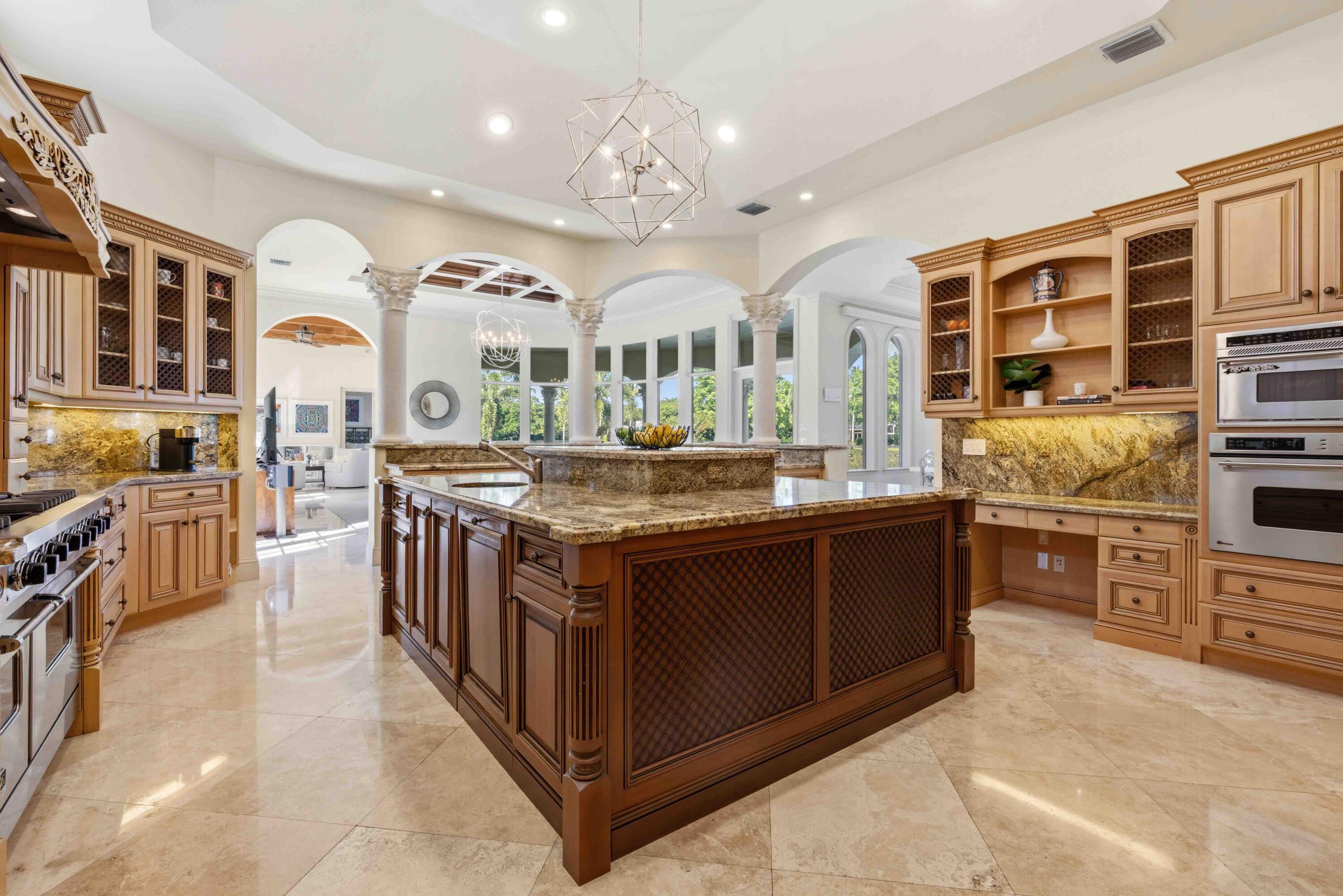 18118 Daybreak Drive Boca Raton, FL 33496 - Photo 21 of 84 a kitchen with stainless steel appliances granite countertop a stove and cabinets