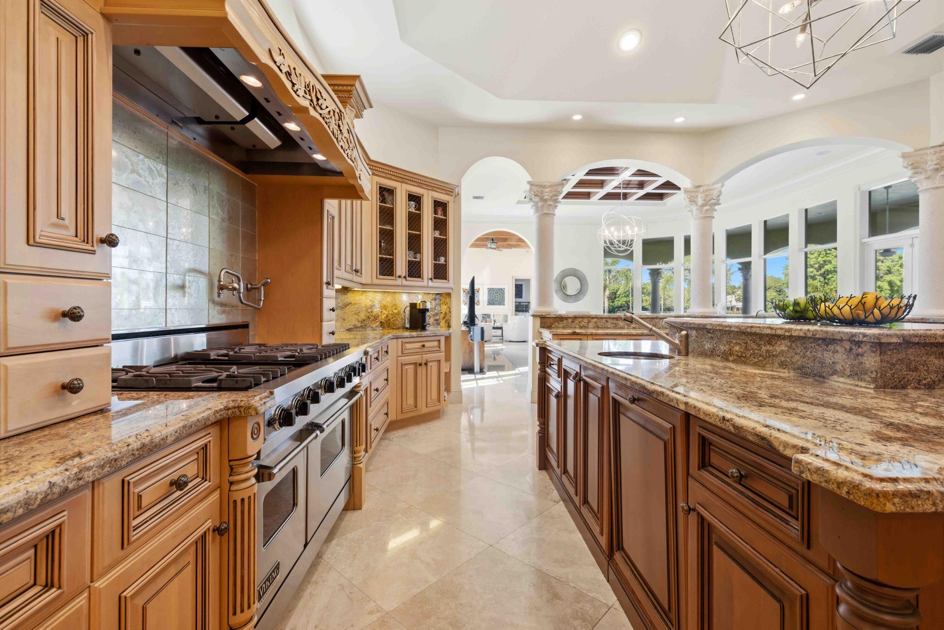 18118 Daybreak Drive Boca Raton, FL 33496 - Photo 24 of 84 a kitchen with stainless steel appliances granite countertop a stove and a sink