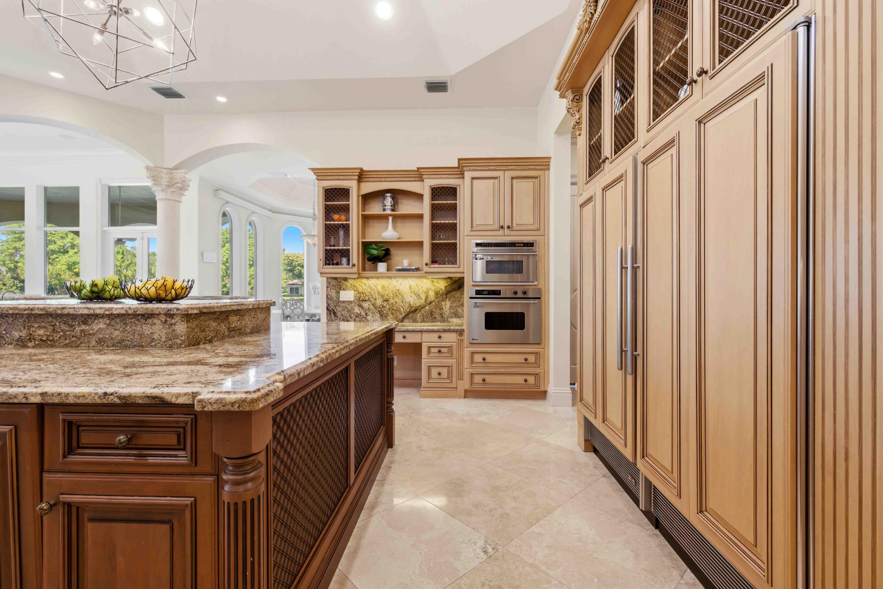 18118 Daybreak Drive Boca Raton, FL 33496 - Photo 26 of 84 a kitchen with stainless steel appliances granite countertop a refrigerator and a sink