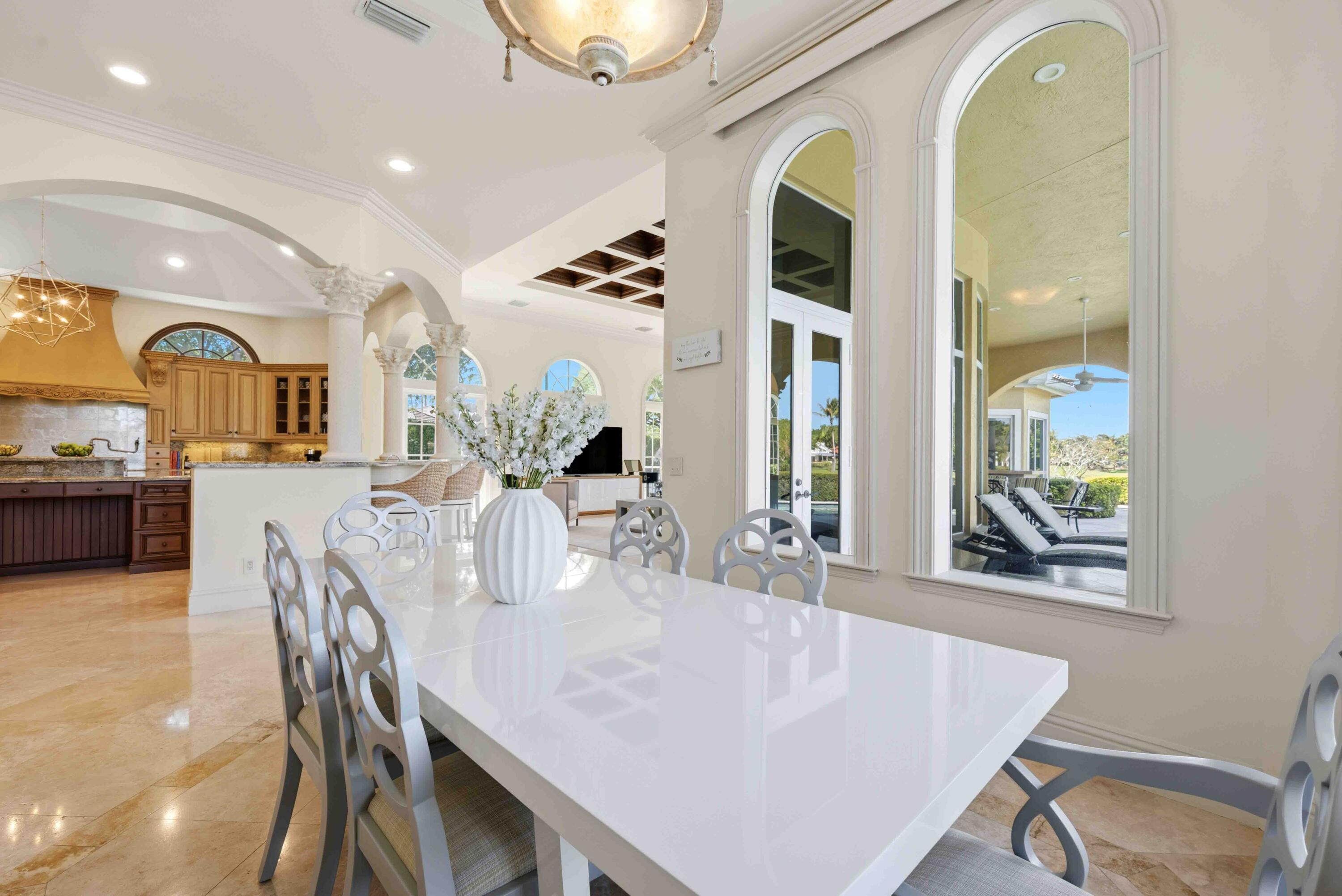 18118 Daybreak Drive Boca Raton, FL 33496 - Photo 27 of 84 a view of a dining room with furniture and a large window