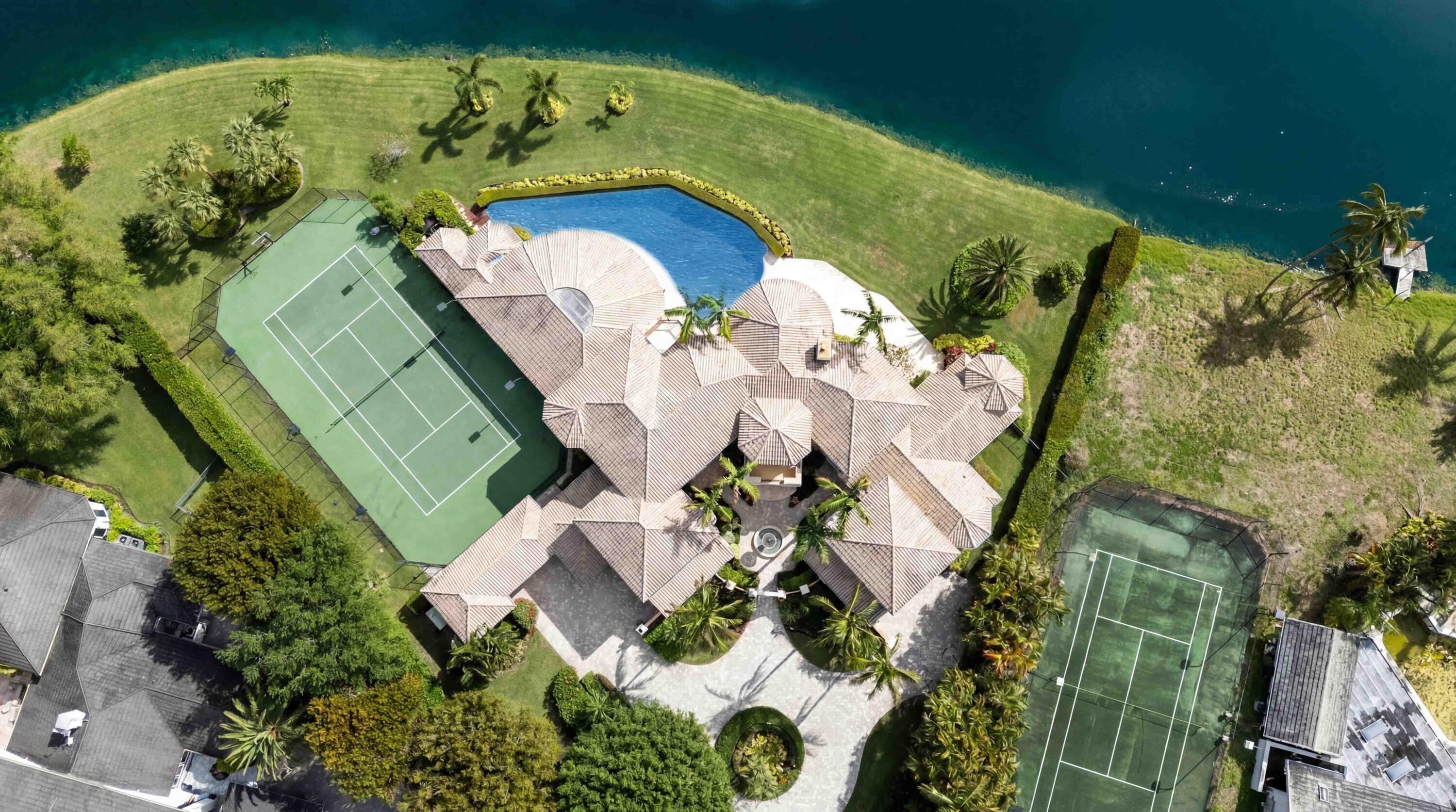 18118 Daybreak Drive Boca Raton, FL 33496 - Photo 4 of 84 an aerial view of a house with a yard and lake view