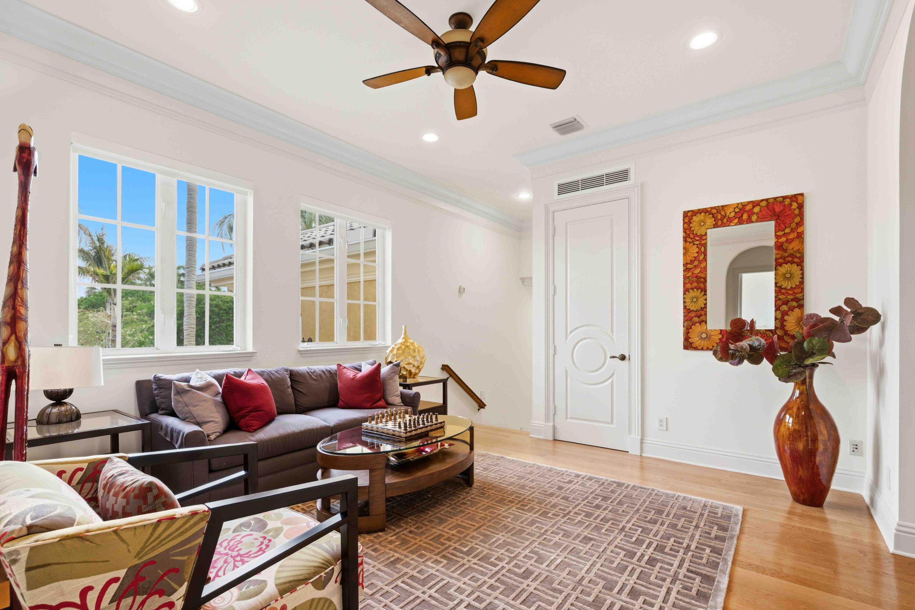 18118 Daybreak Drive Boca Raton, FL 33496 - Photo 49 of 84 a living room with furniture and a window