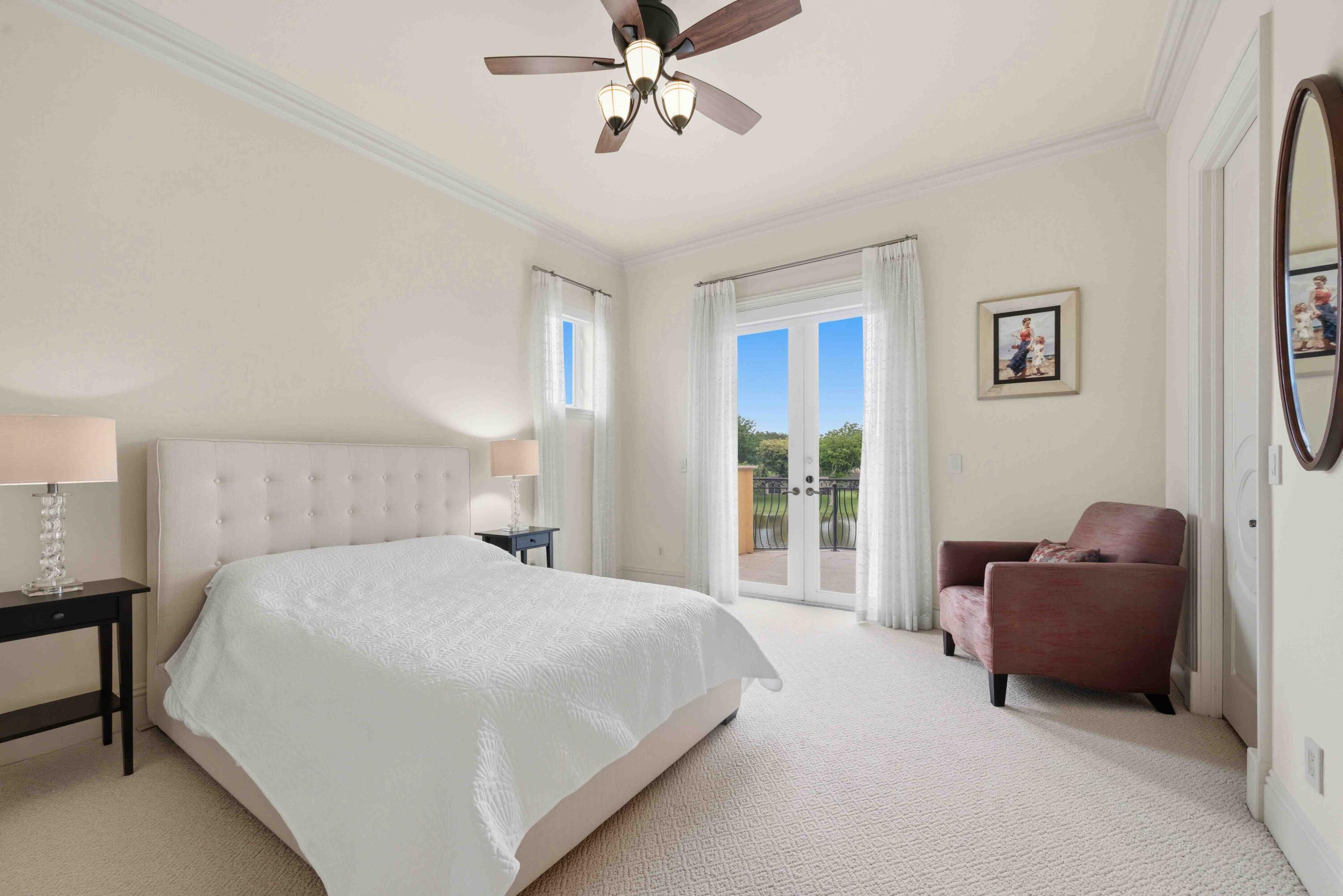 18118 Daybreak Drive Boca Raton, FL 33496 - Photo 52 of 84 a bedroom with a bed couch and a window