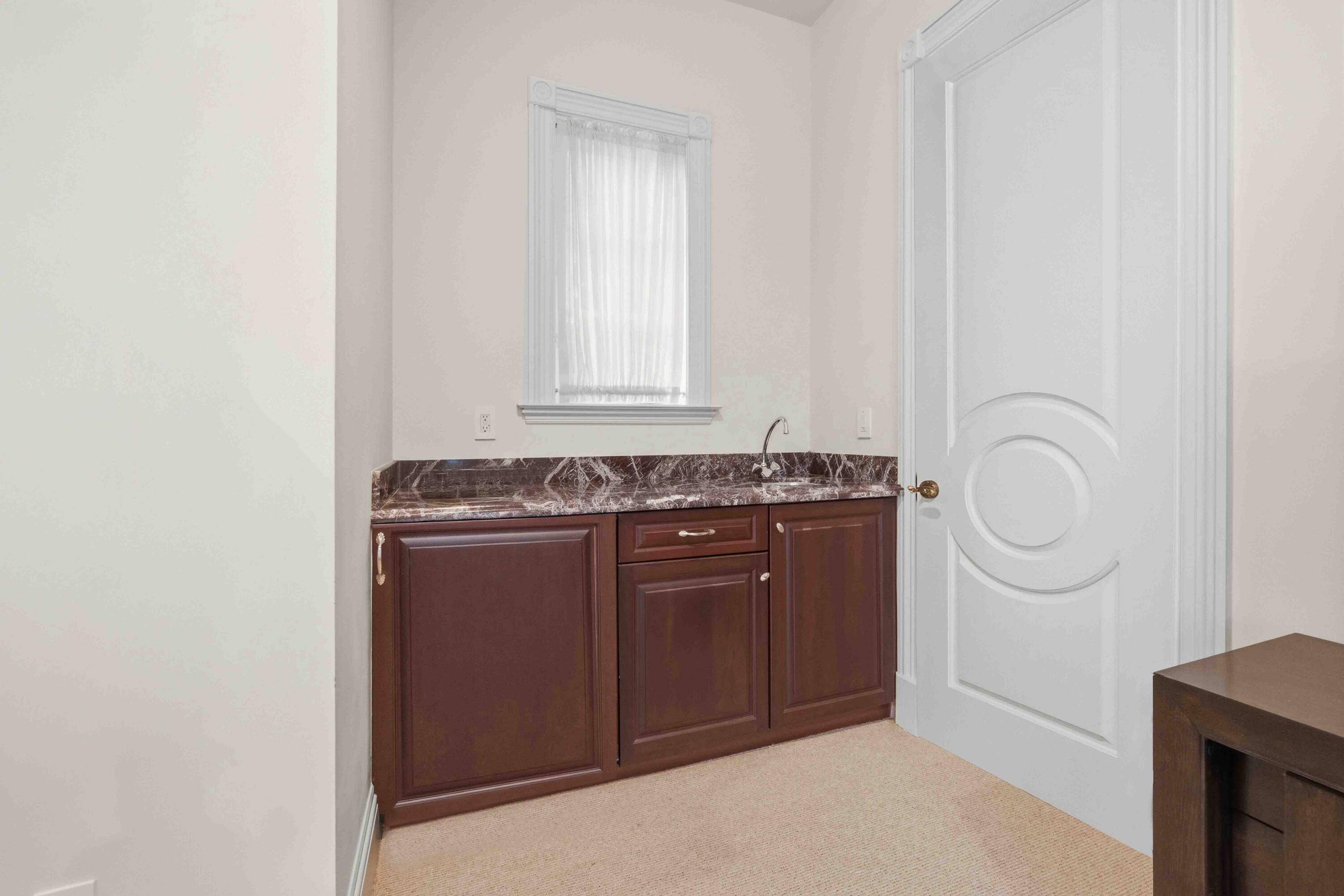 18118 Daybreak Drive Boca Raton, FL 33496 - Photo 63 of 84 a room with a sink a vanity and a mirror