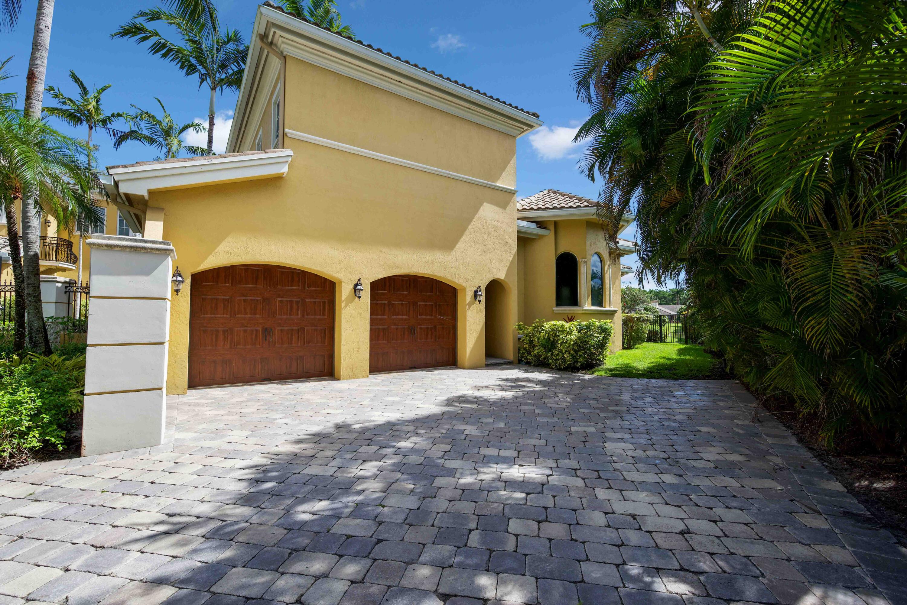 18118 Daybreak Drive Boca Raton, FL 33496 - Photo 66 of 84 a front view of a house with yard and parking