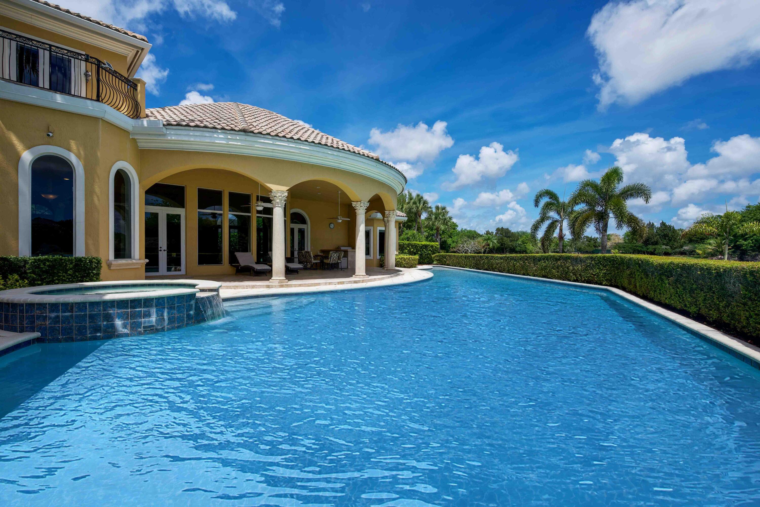 18118 Daybreak Drive Boca Raton, FL 33496 - Photo 68 of 84 a view of a house with a swimming pool