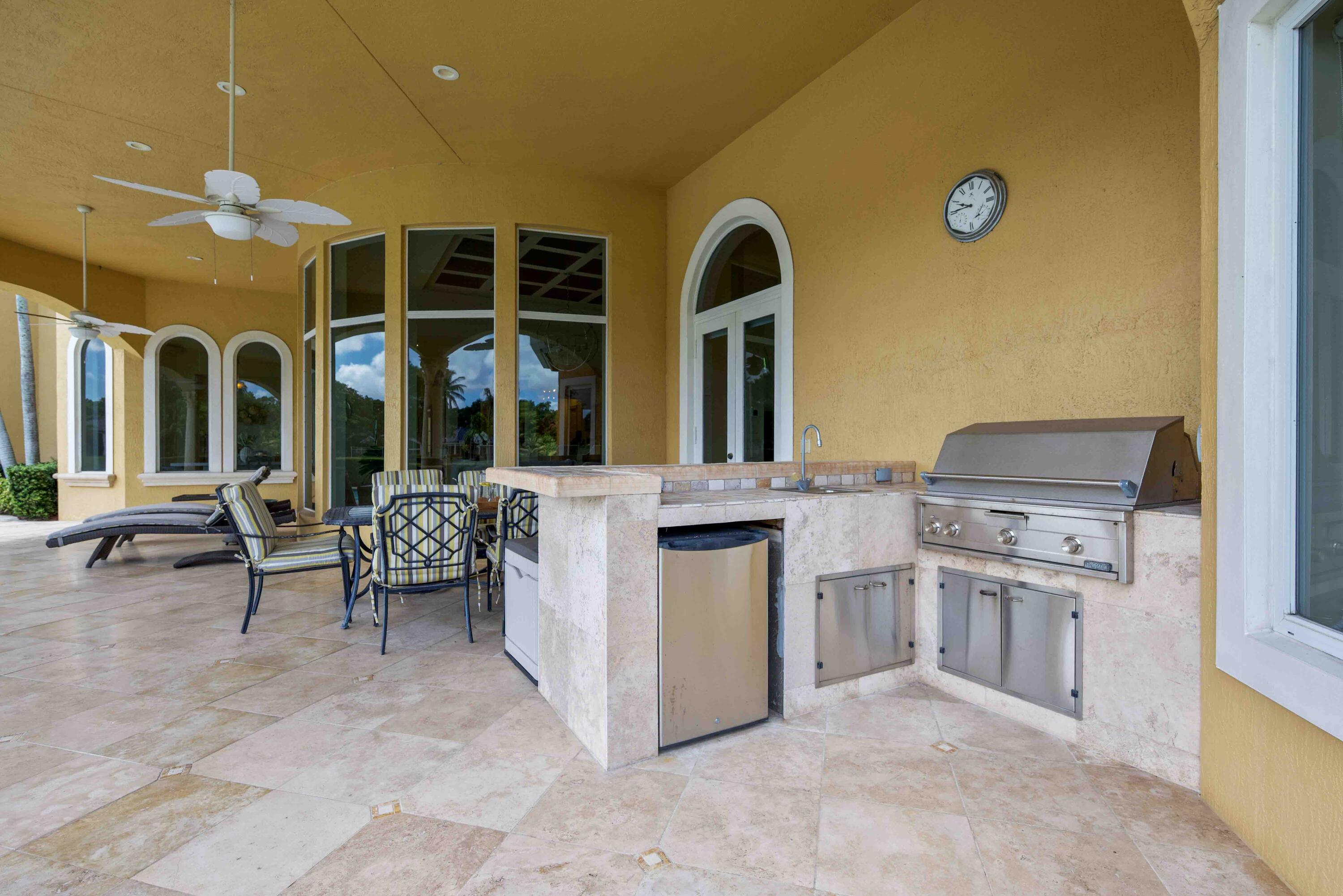 18118 Daybreak Drive Boca Raton, FL 33496 - Photo 72 of 84 a living room with furniture and a fireplace
