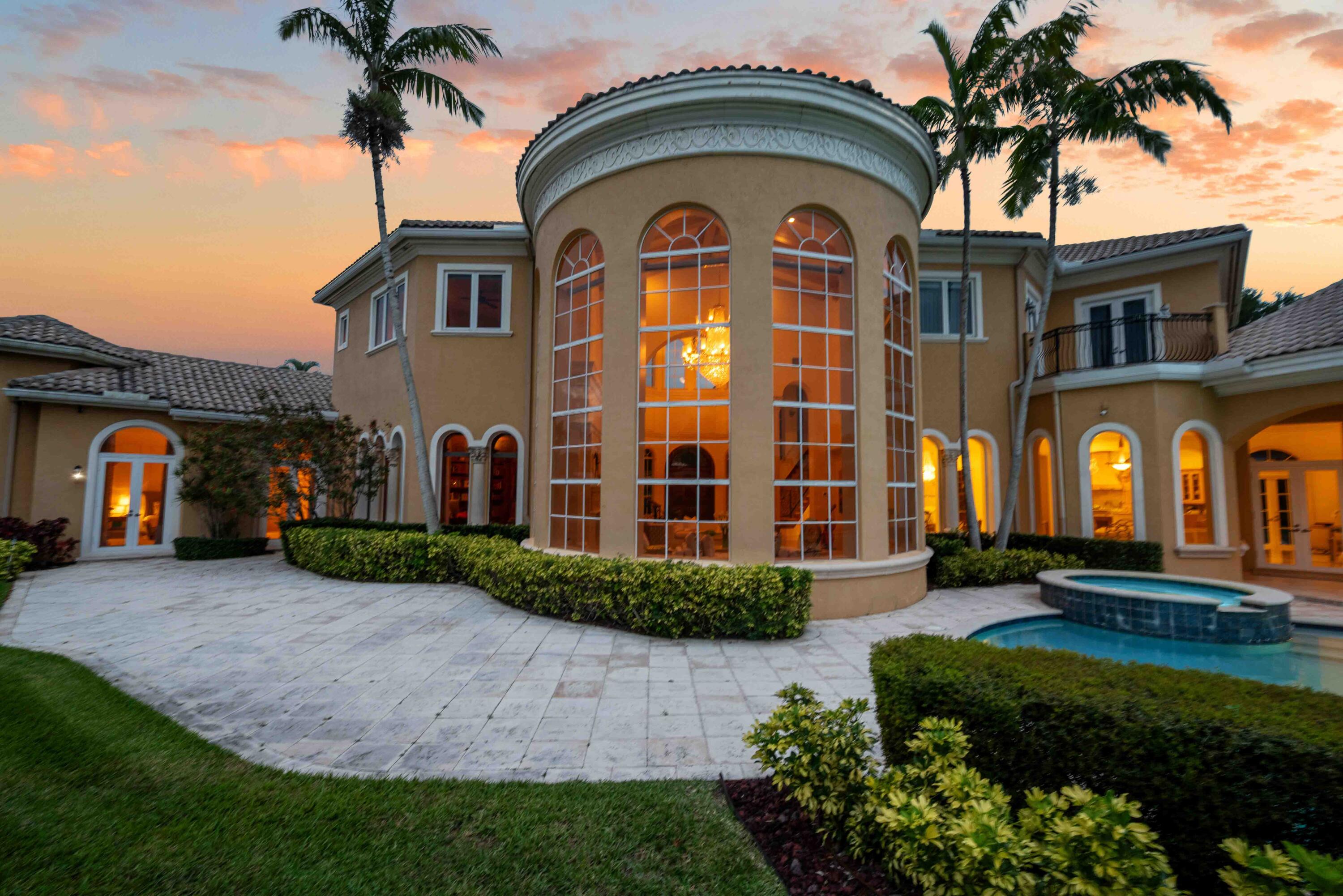 18118 Daybreak Drive Boca Raton, FL 33496 - Photo 81 of 84 a front view of a house with a garden
