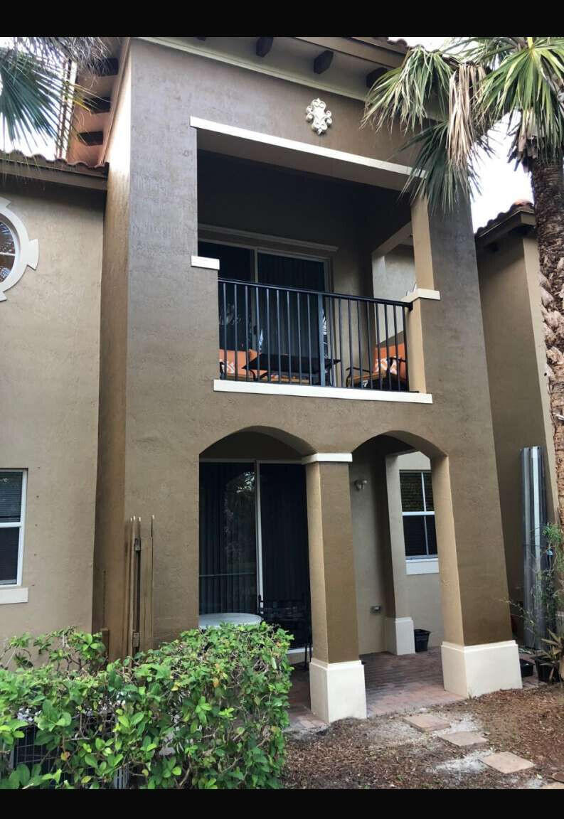 2944 Hidden Hills Road, Unit 1604 West Palm Beach, FL 33411 - Photo 1 of 11 a front view of a house with a yard