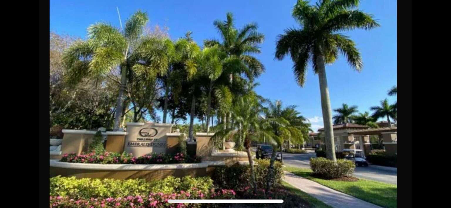 2944 Hidden Hills Road, Unit 1604 West Palm Beach, FL 33411 - Photo 2 of 11 a view of a backyard