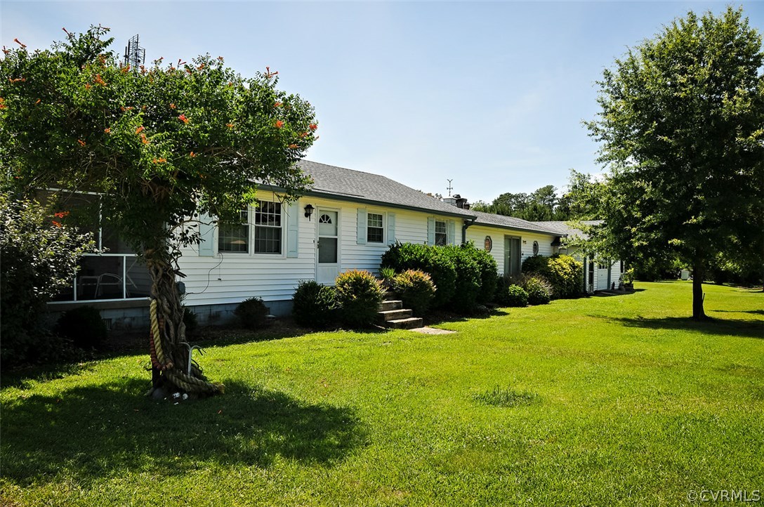 319 Beaumar Road Moon, VA 23119 - Photo 1 of 24 a view of a house with a yard and tree s