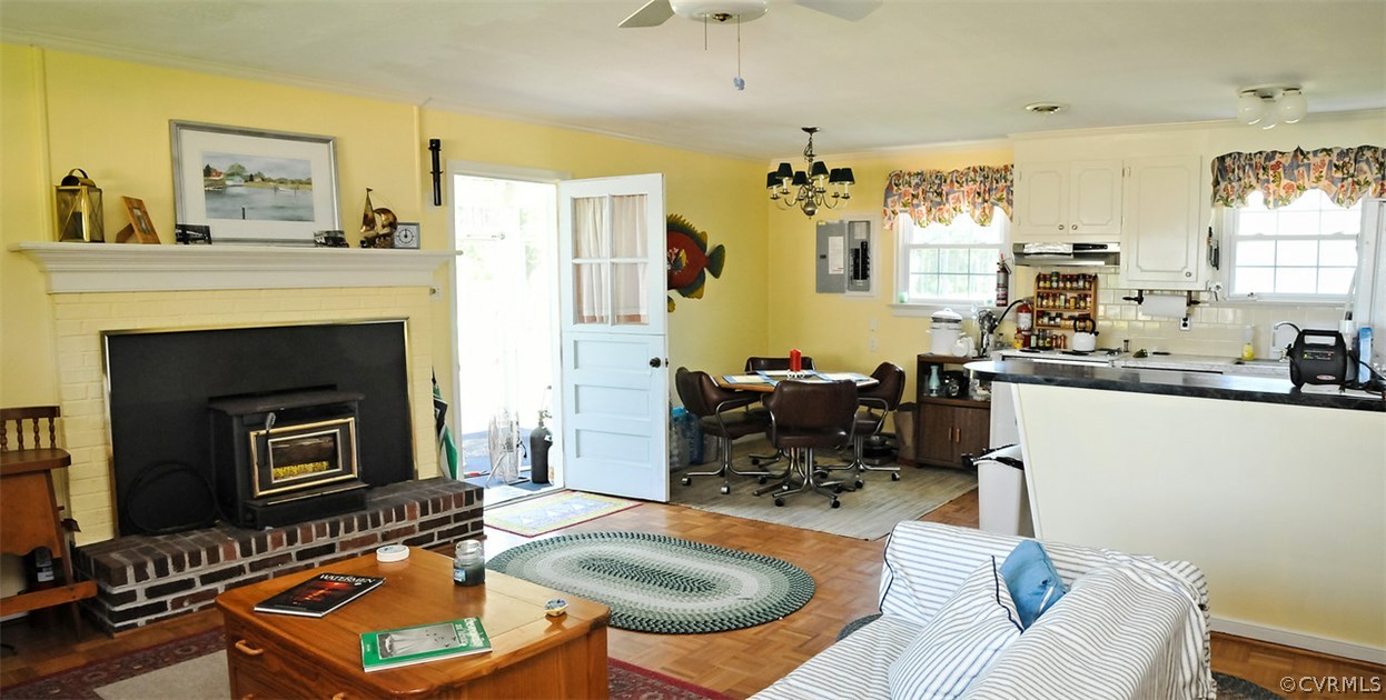 319 Beaumar Road Moon, VA 23119 - Photo 11 of 24 a living room with furniture a fireplace a rug and a window