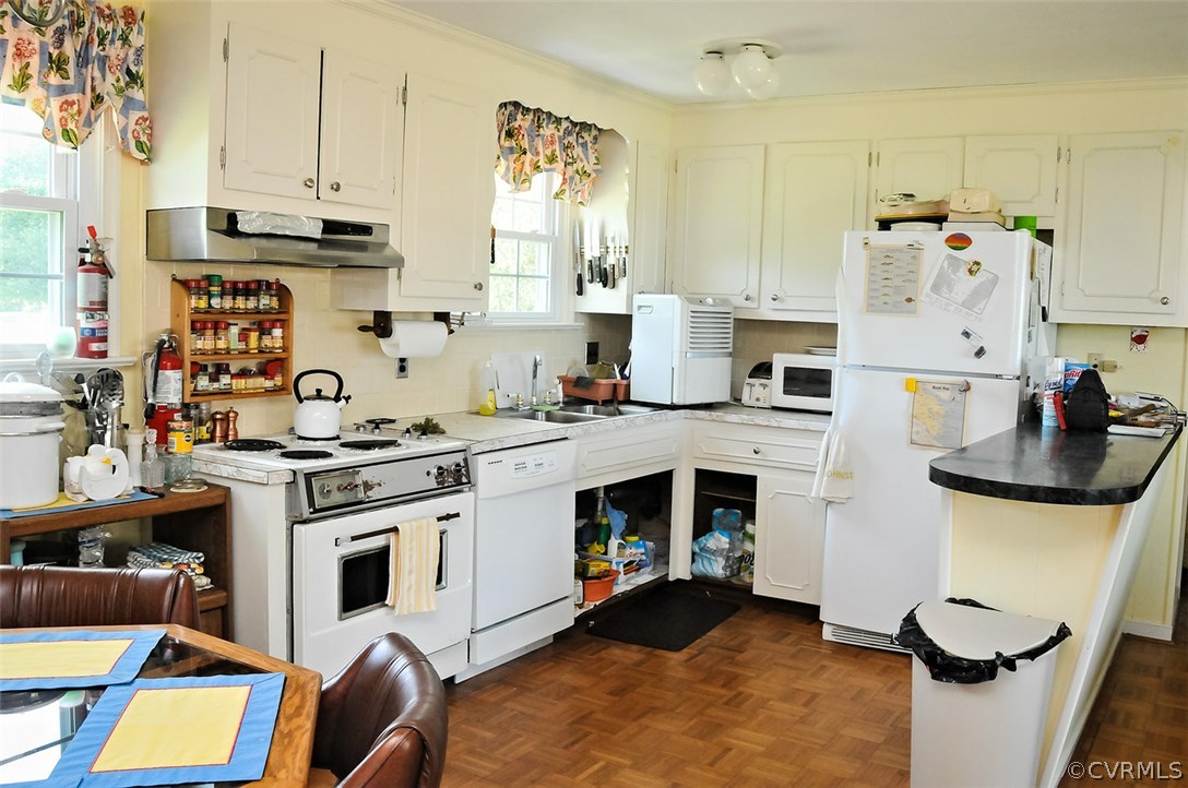 319 Beaumar Road Moon, VA 23119 - Photo 12 of 24 a kitchen with stainless steel appliances a stove a sink and a refrigerator