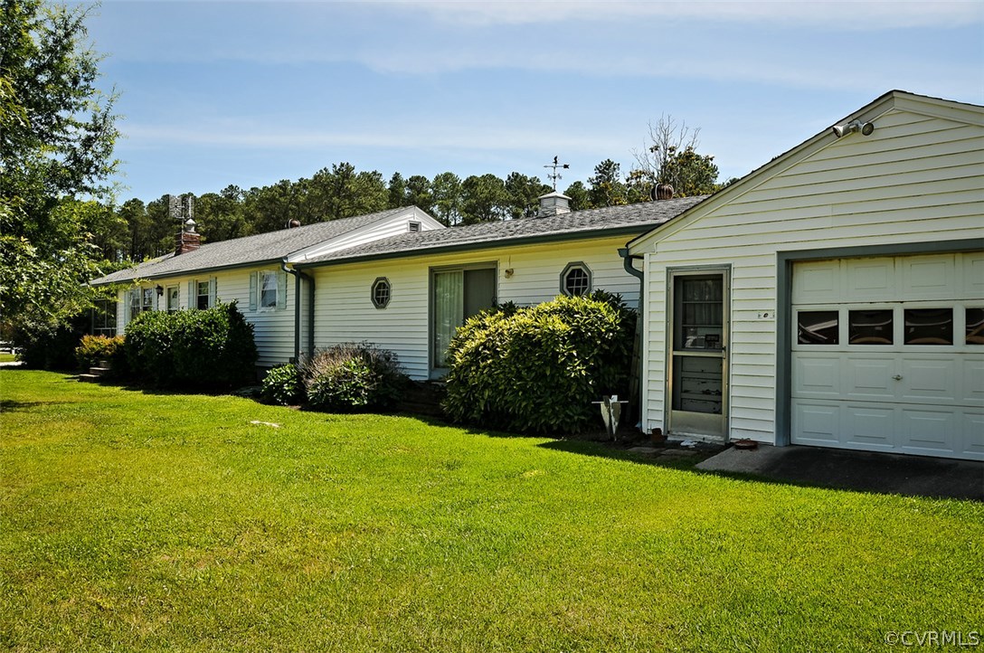 319 Beaumar Road Moon, VA 23119 - Photo 23 of 24 a view of a house with a yard and potted plants