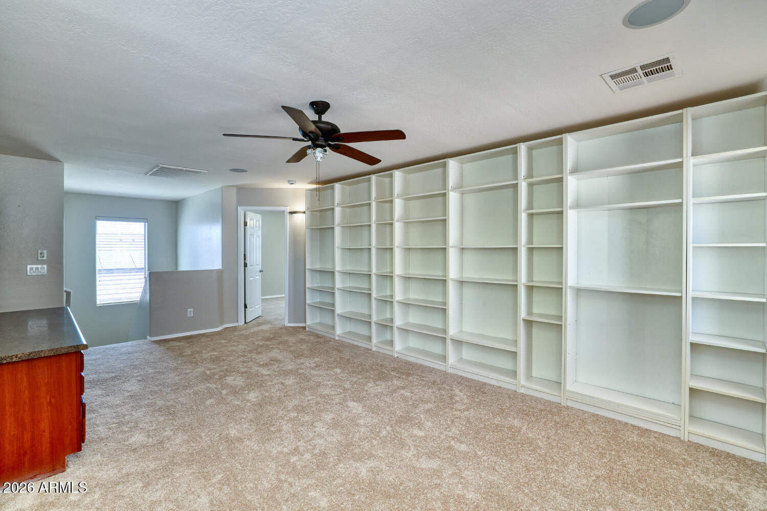 21619 West Durango Street Buckeye, AZ 85326 - Photo 20 of 30 a view of an empty room with a cabinet and a window