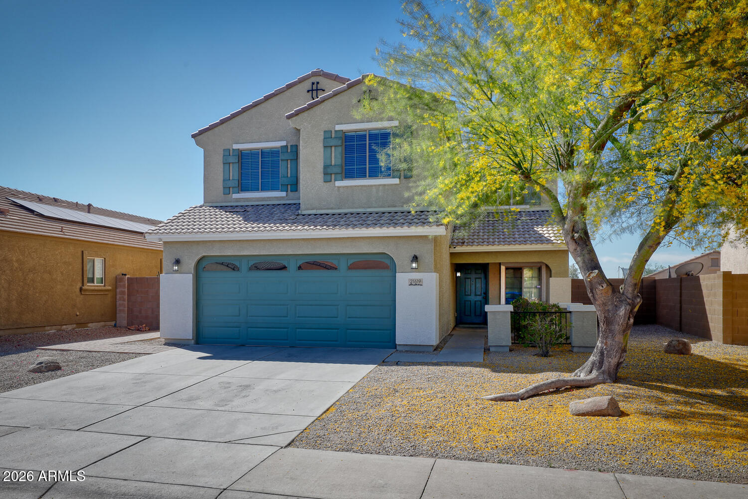 21619 West Durango Street Buckeye, AZ 85326 - Photo 2 of 30 a front view of a house with garden