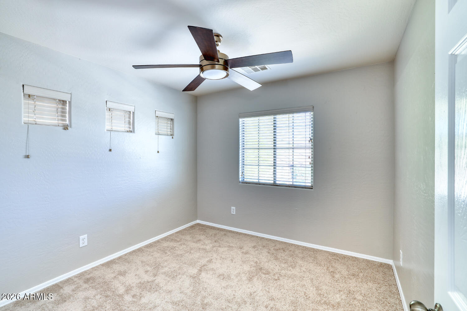 21619 West Durango Street Buckeye, AZ 85326 - Photo 22 of 30 a view of an empty room with a window