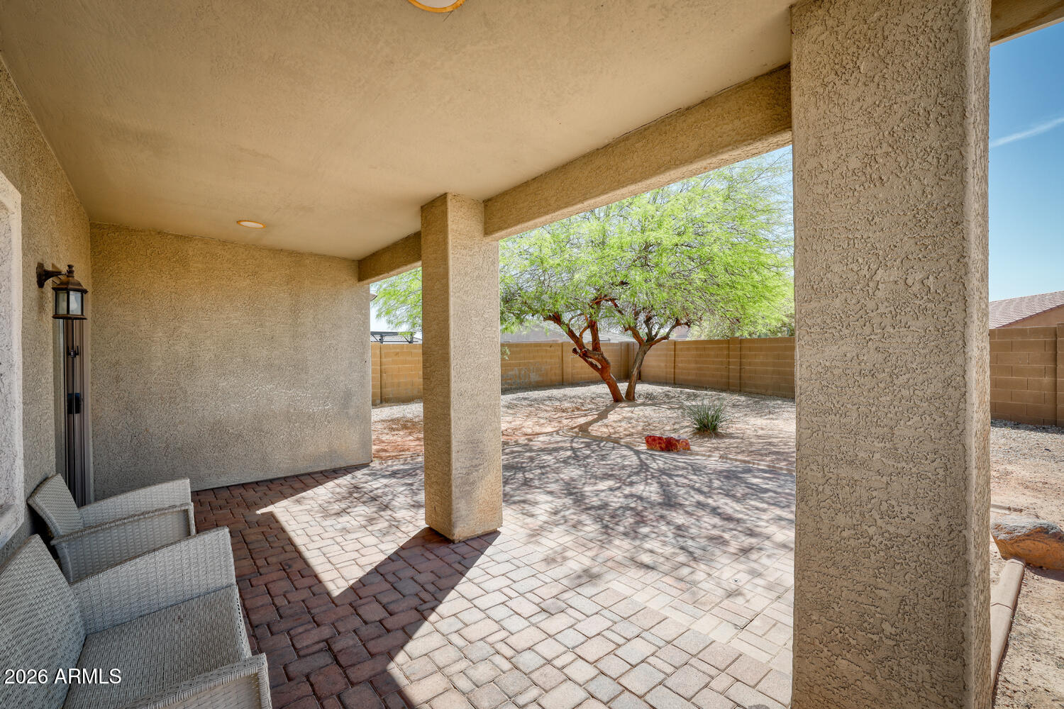 21619 West Durango Street Buckeye, AZ 85326 - Photo 29 of 30 a living room with furniture and a floor to ceiling window