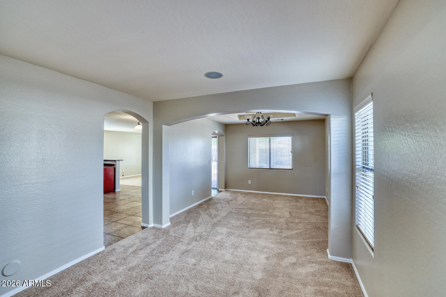21619 West Durango Street Buckeye, AZ 85326 - Photo 5 of 30 an empty room with window and stairs