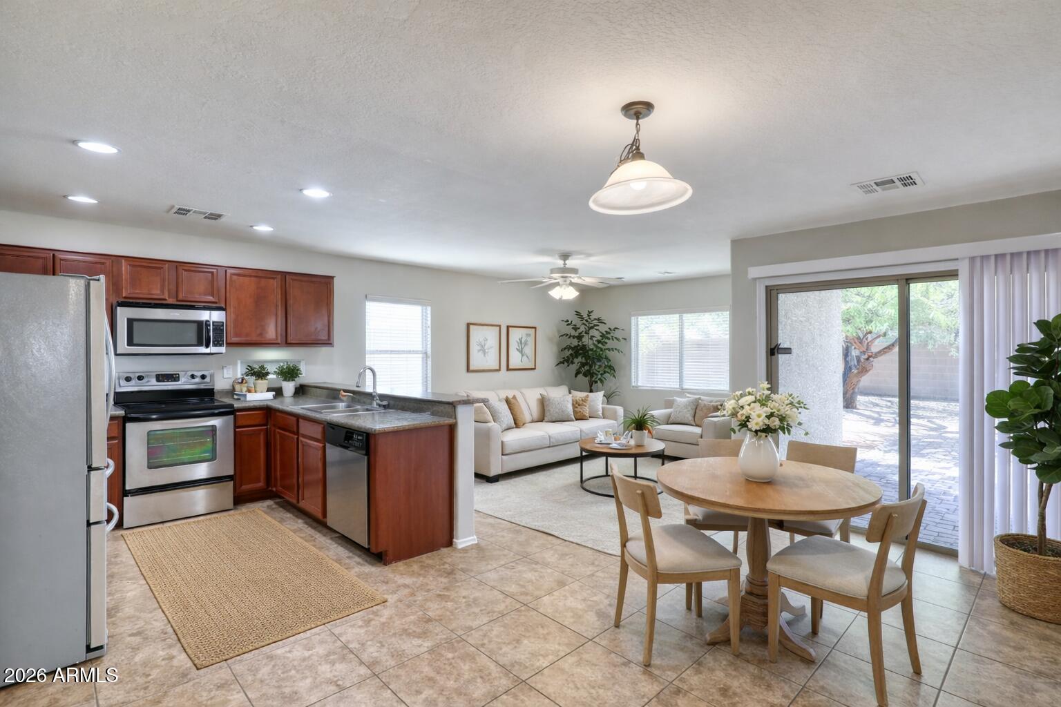 21619 West Durango Street Buckeye, AZ 85326 - Photo 10 of 30 a large kitchen with a table and chairs in it