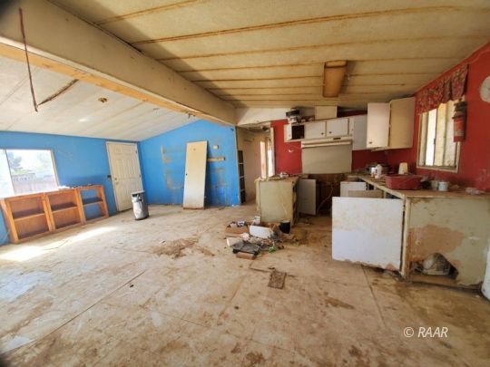 4544 West Ward Avenue Ridgecrest, CA 93555 - Photo 8 of 19 a room with storage and furniture