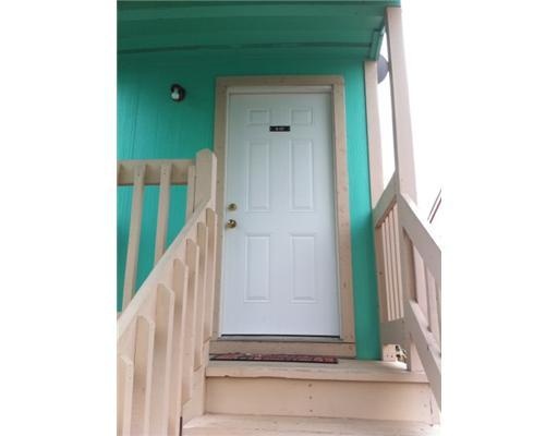 a view of staircase with white walls