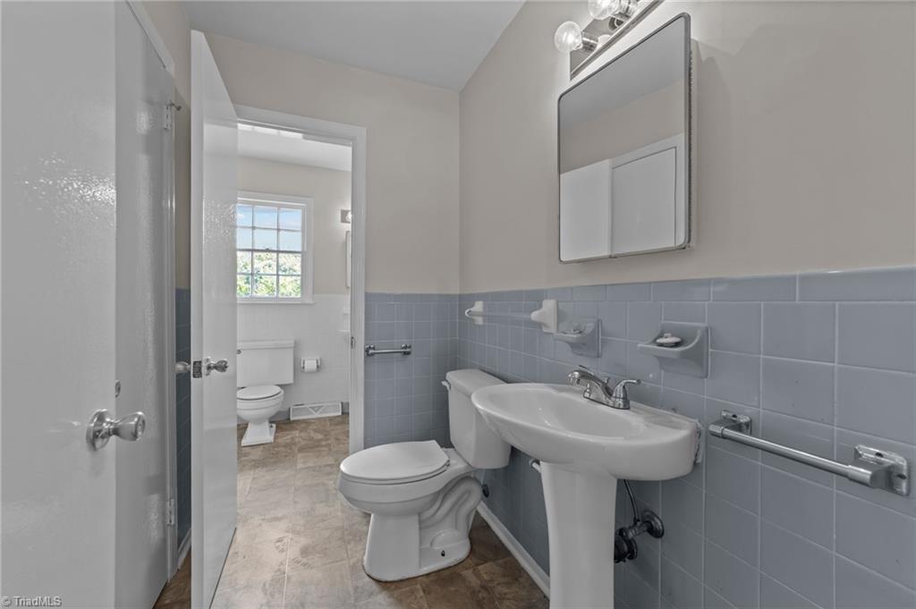 2507 Fontaine Road Greensboro, NC 27407 - Photo 10 of 34 Attached primary bath opens up another full bathroom report