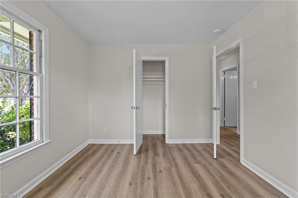 2507 Fontaine Road Greensboro, NC 27407 - Photo 11 of 34 Second bedroom with ample closet space and located near the primary bed.