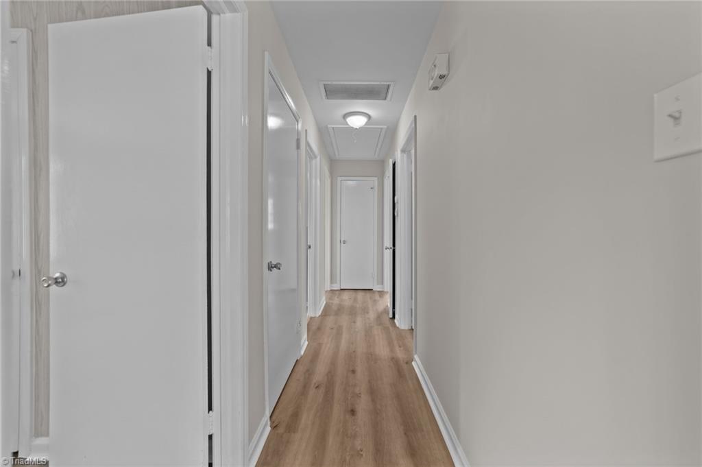 2507 Fontaine Road Greensboro, NC 27407 - Photo 22 of 34 Hallway to the bedrooms.