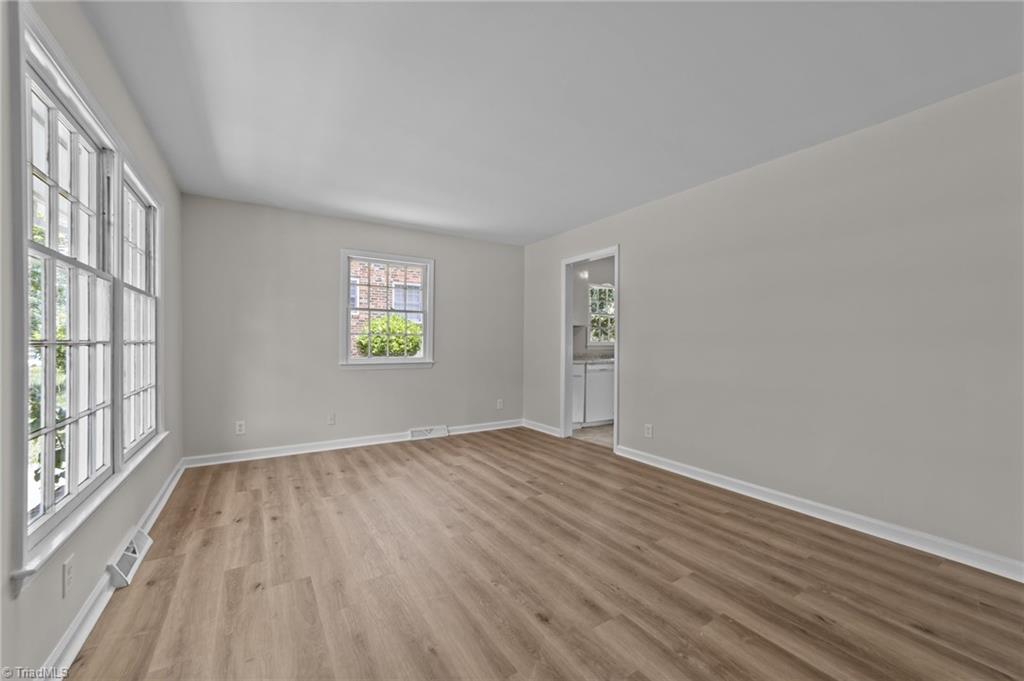 2507 Fontaine Road Greensboro, NC 27407 - Photo 4 of 34 Living room with big front windows that fills the room with natural lighting.