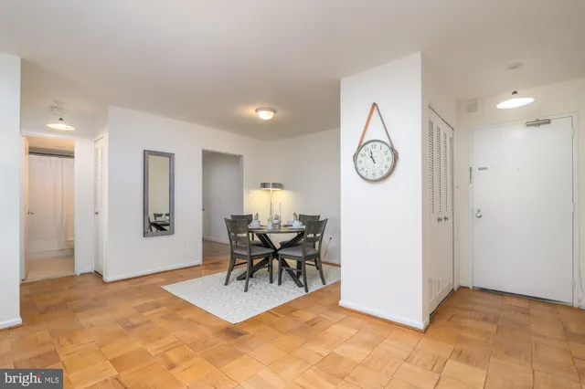 a view of work space with furniture and wooden floor