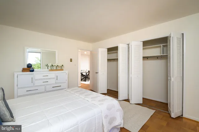 a bedroom with a bed and a cabinets