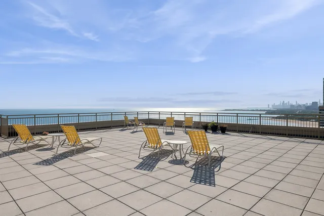 an outdoor view with swimming pool and seating