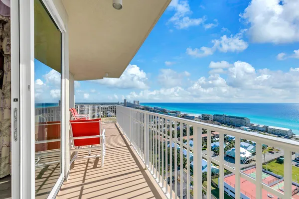 a balcony with an outdoor seating