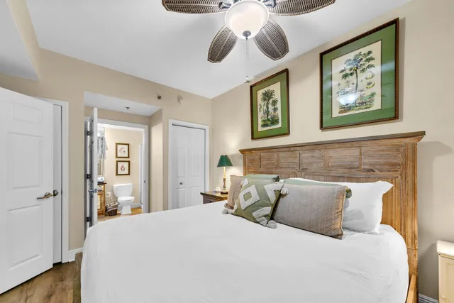 a bedroom with a bed and lamp