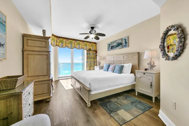 a bed room with a bed and a chair