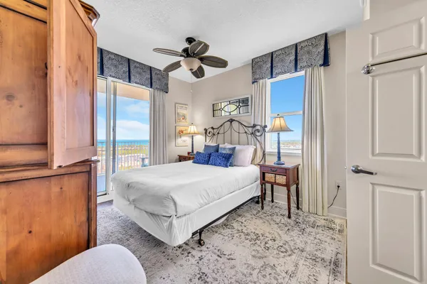 a bedroom with a bed dresser and a window