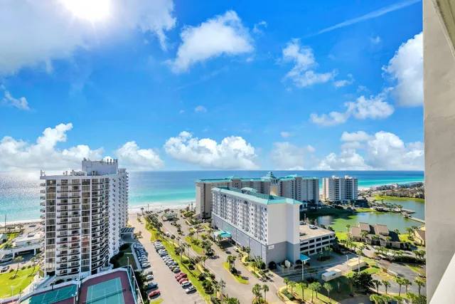 a view of a balcony with two chairs and a table